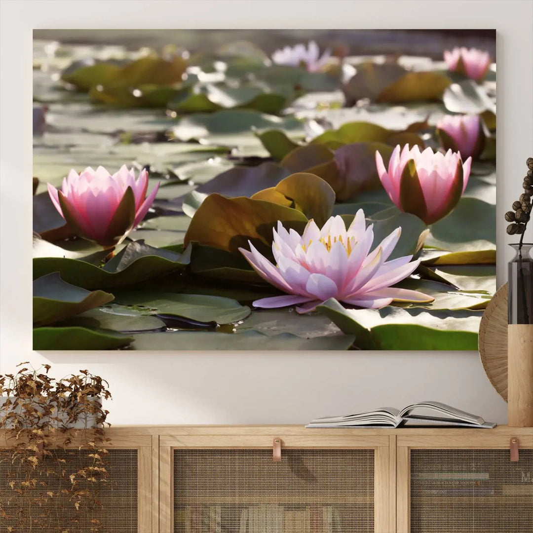 A dining room with a Lotus Flower Wall Art Canvas Print featuring pink water lilies.