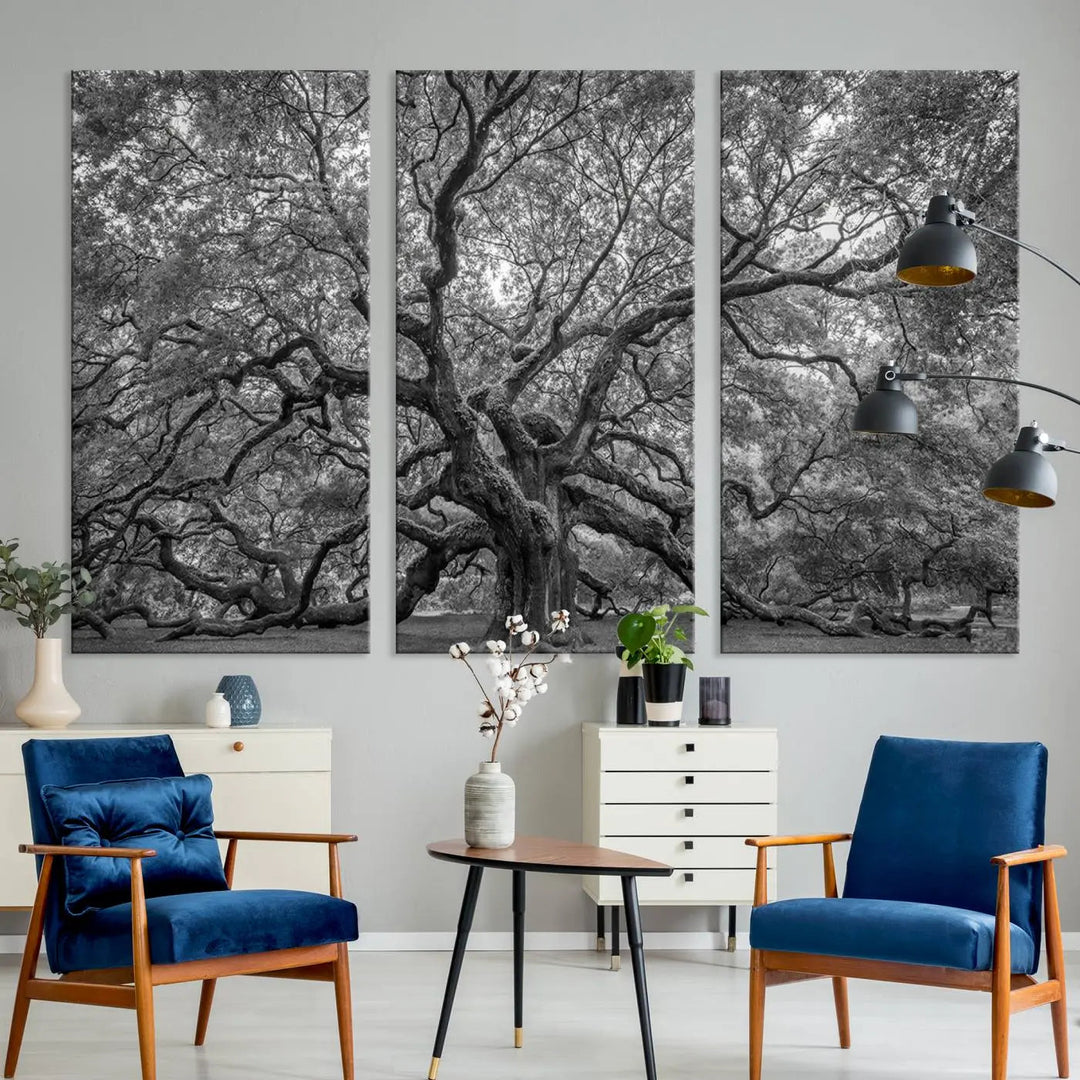 A modern living room highlighted by a striking Majestic Angel Oak Tree Black and White Canvas Print—Multi Panel Wall Art, Giclée Print—adorning the wall.