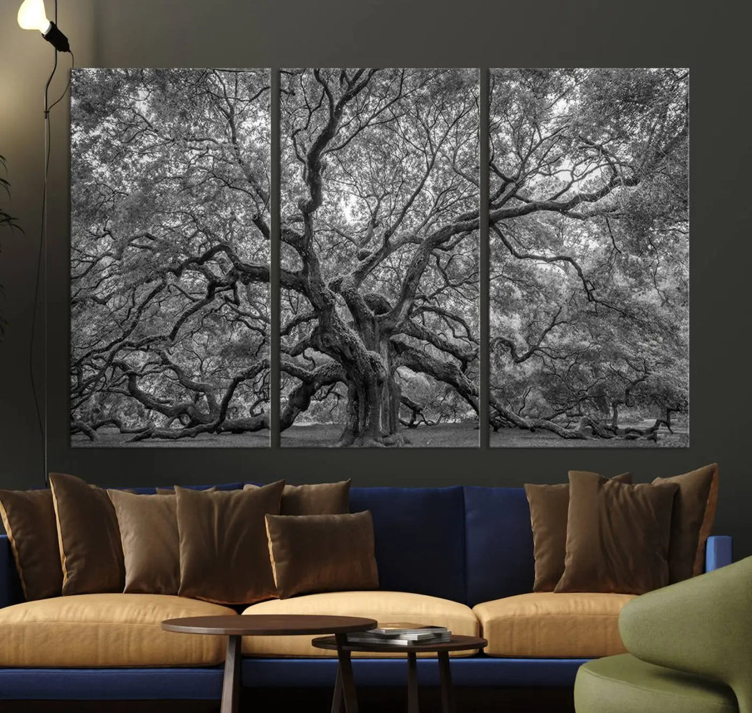 A modern living room highlighted by a striking Majestic Angel Oak Tree Black and White Canvas Print—Multi Panel Wall Art, Giclée Print—adorning the wall.