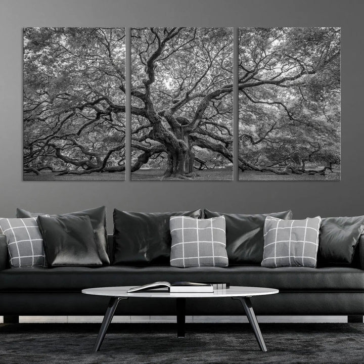 A modern living room highlighted by a striking Majestic Angel Oak Tree Black and White Canvas Print—Multi Panel Wall Art, Giclée Print—adorning the wall.