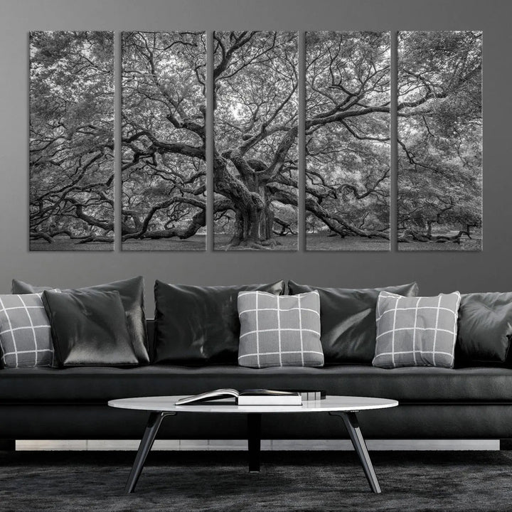 A modern living room highlighted by a striking Majestic Angel Oak Tree Black and White Canvas Print—Multi Panel Wall Art, Giclée Print—adorning the wall.