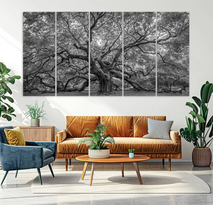 A modern living room highlighted by a striking Majestic Angel Oak Tree Black and White Canvas Print—Multi Panel Wall Art, Giclée Print—adorning the wall.