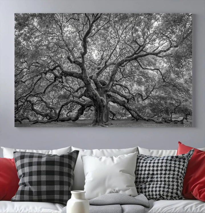 A modern living room highlighted by a striking Majestic Angel Oak Tree Black and White Canvas Print—Multi Panel Wall Art, Giclée Print—adorning the wall.