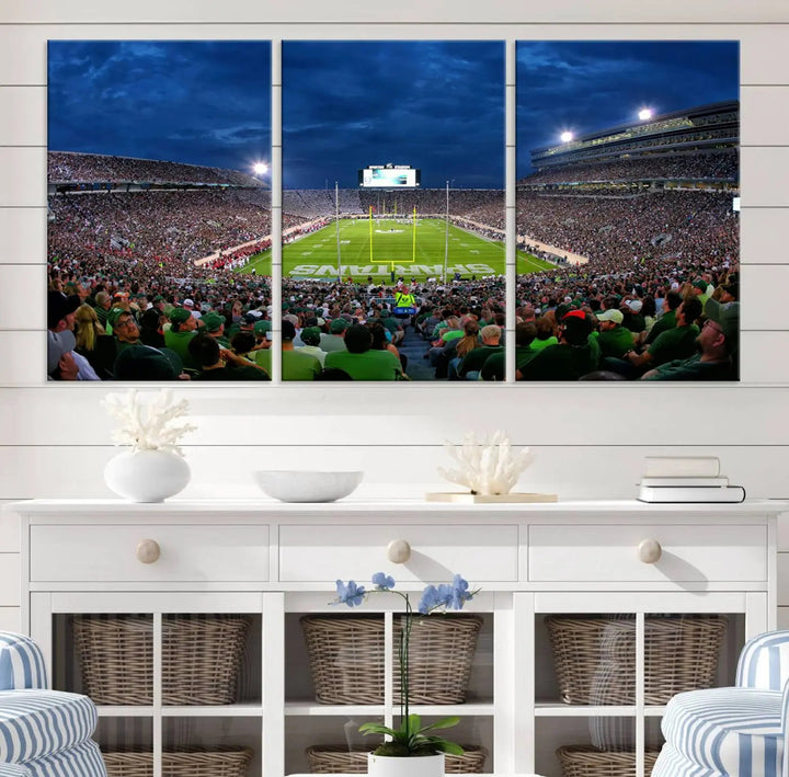 The living room features a Michigan State Spartans Football Team Print, showcasing East Lansing's Spartan Stadium as a triptych wall art above the sofa.