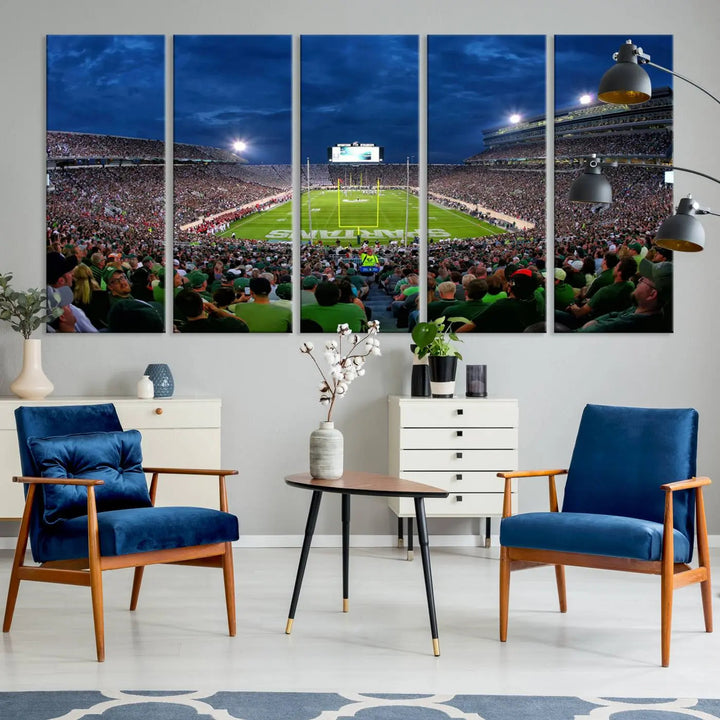 The living room features a Michigan State Spartans Football Team Print, showcasing East Lansing's Spartan Stadium as a triptych wall art above the sofa.