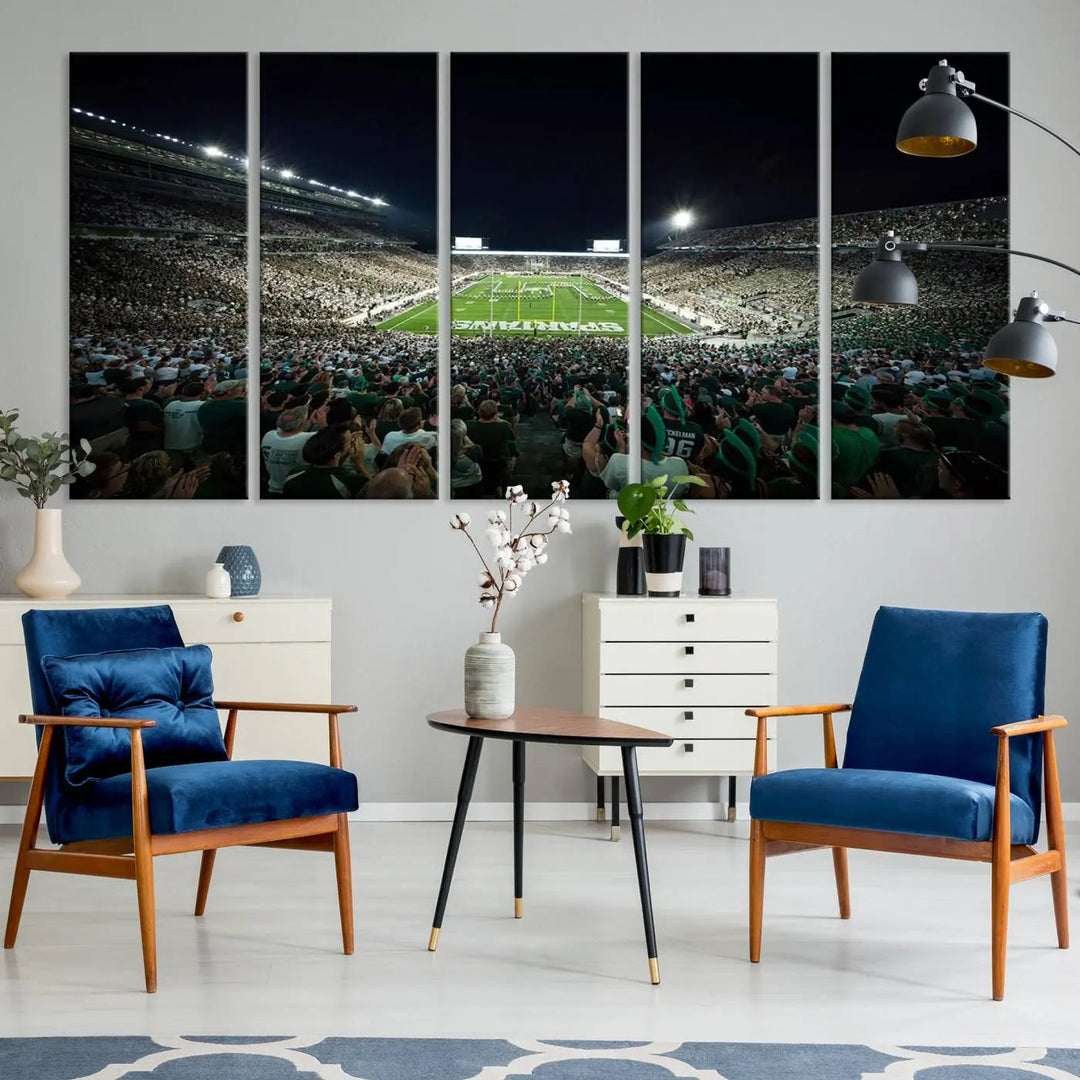 The Michigan State Spartans Football Team Print features an impressive depiction of East Lansing's Spartan Stadium at night, packed with enthusiastic fans. This captivating wall art boasts a gallery-quality finish that enchants any viewer.