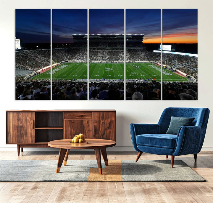 The room showcases a triptych wall art featuring the Michigan State Spartans football team at East Lansing Spartan Stadium at dusk, elegantly printed on premium canvas for a gallery-quality finish.