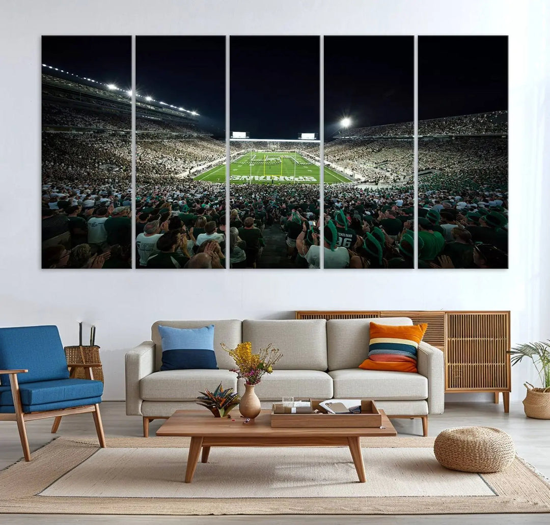 The Michigan State Spartans Football Team Print features an impressive depiction of East Lansing's Spartan Stadium at night, packed with enthusiastic fans. This captivating wall art boasts a gallery-quality finish that enchants any viewer.