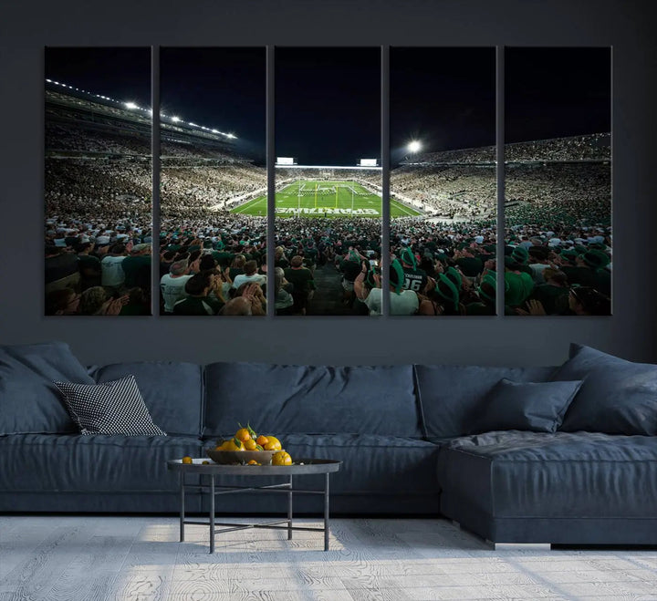 The Michigan State Spartans Football Team Print features an impressive depiction of East Lansing's Spartan Stadium at night, packed with enthusiastic fans. This captivating wall art boasts a gallery-quality finish that enchants any viewer.