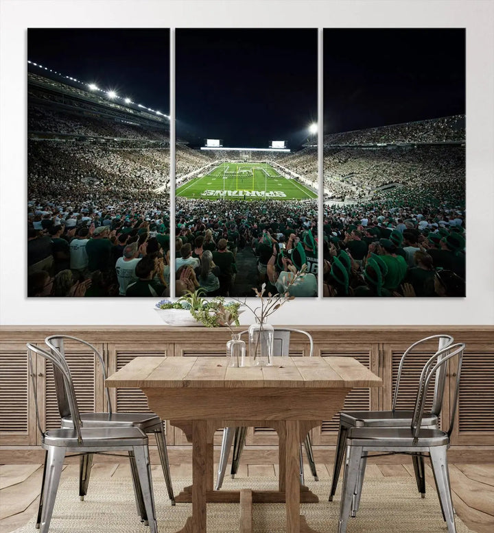 The Michigan State Spartans Football Team Print features an impressive depiction of East Lansing's Spartan Stadium at night, packed with enthusiastic fans. This captivating wall art boasts a gallery-quality finish that enchants any viewer.