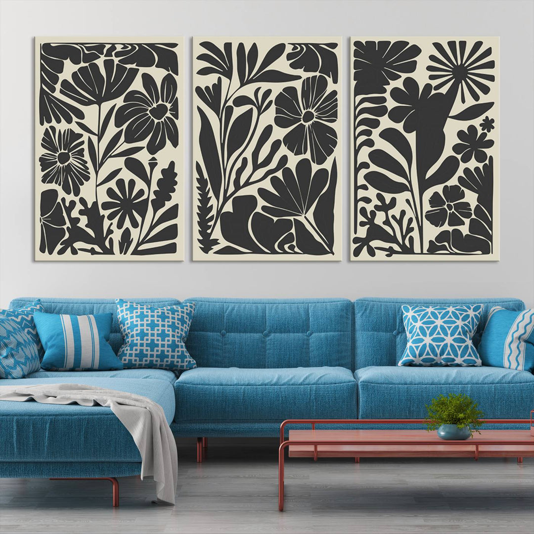 A modern living room features framed black & white botanical wall art that adds flair.