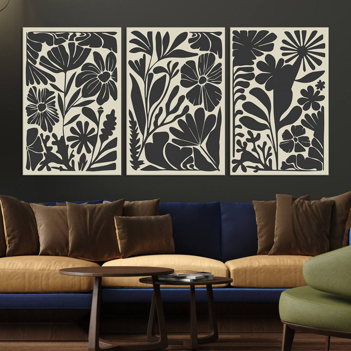 A modern living room features framed black & white botanical wall art that adds flair.