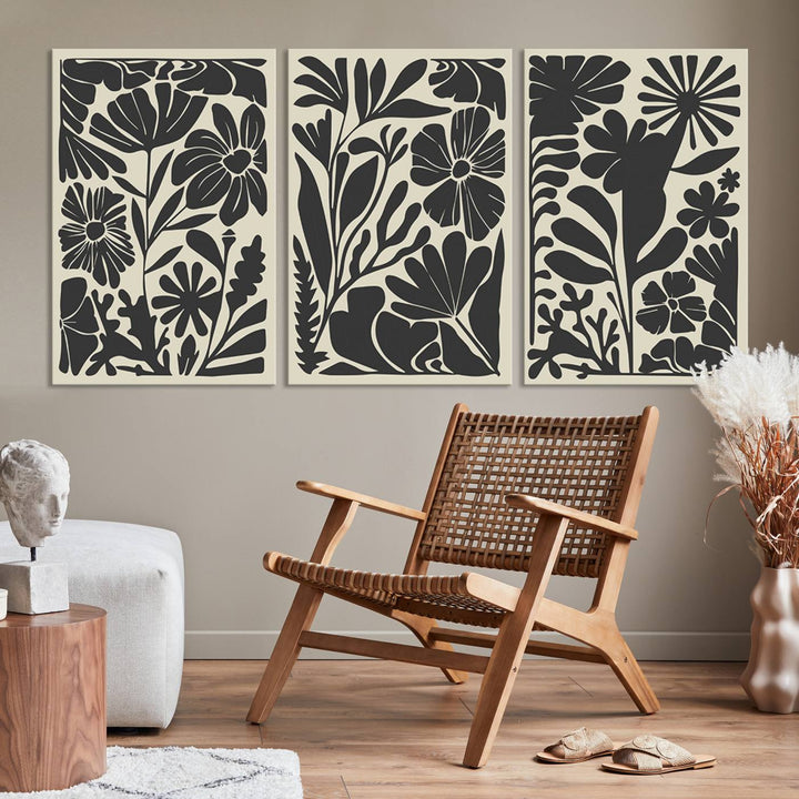 A modern living room features framed black & white botanical wall art that adds flair.