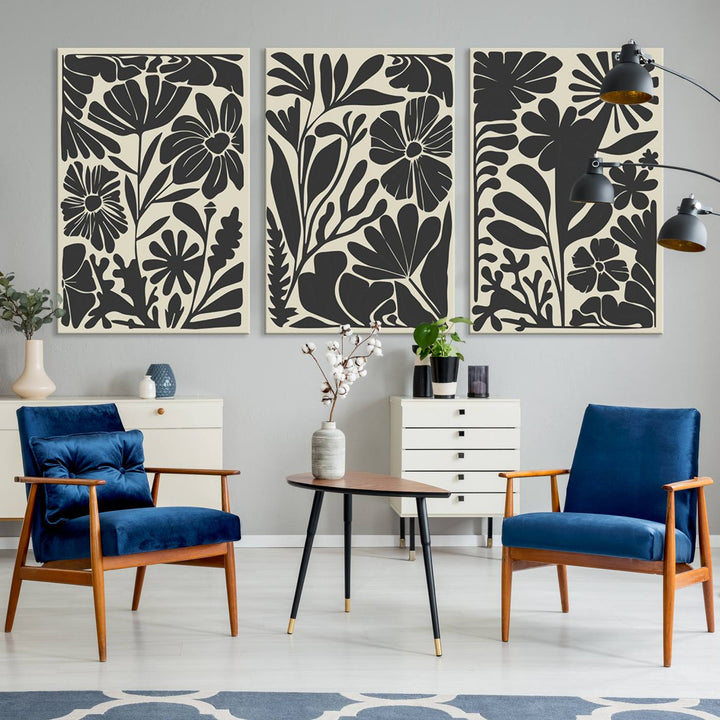 A modern living room features framed black & white botanical wall art that adds flair.