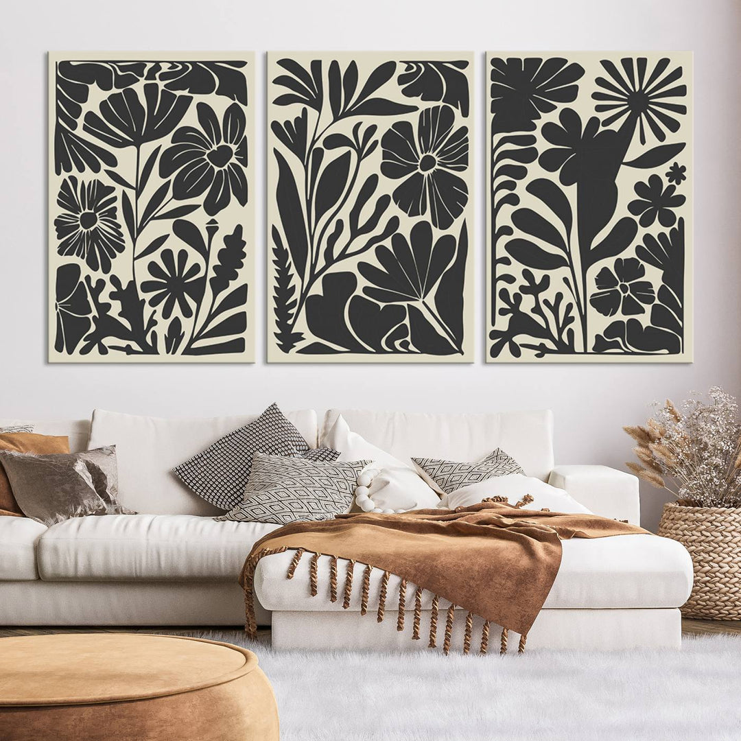 A modern living room features framed black & white botanical wall art that adds flair.