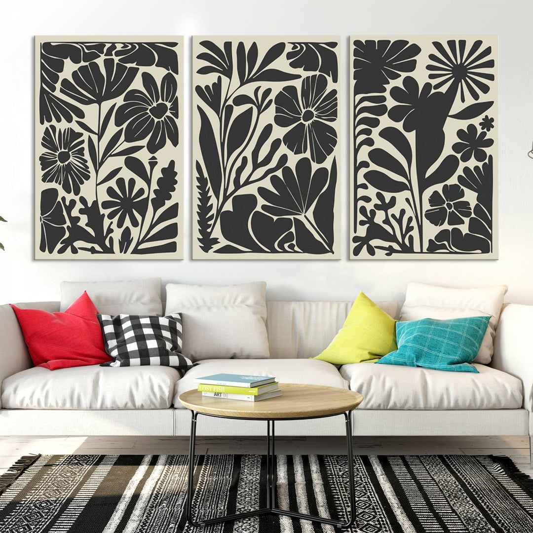 A modern living room features framed black & white botanical wall art that adds flair.