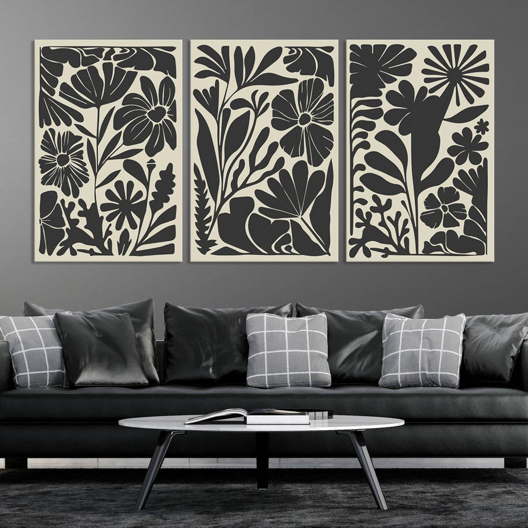 A modern living room features framed black & white botanical wall art that adds flair.