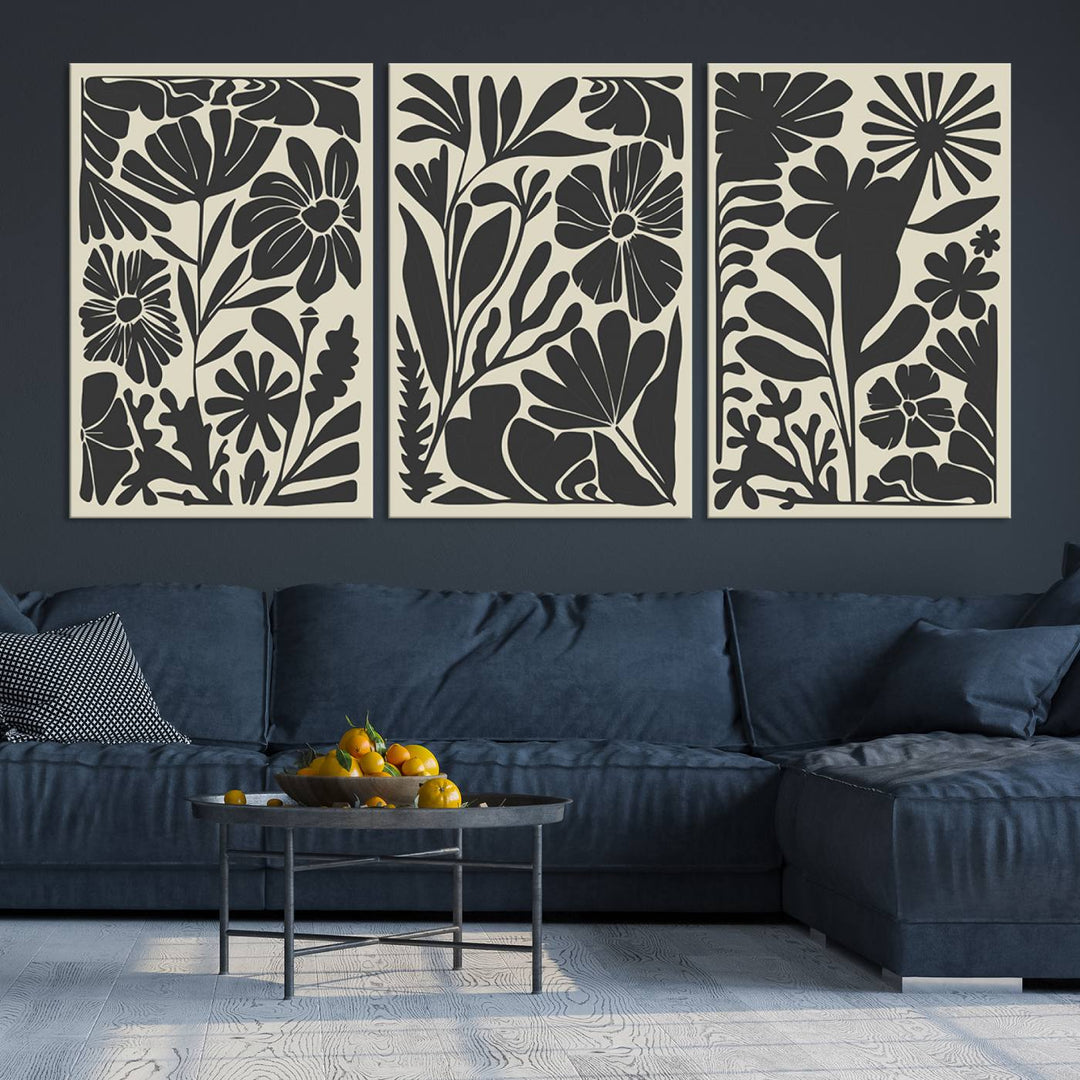 A modern living room features framed black & white botanical wall art that adds flair.