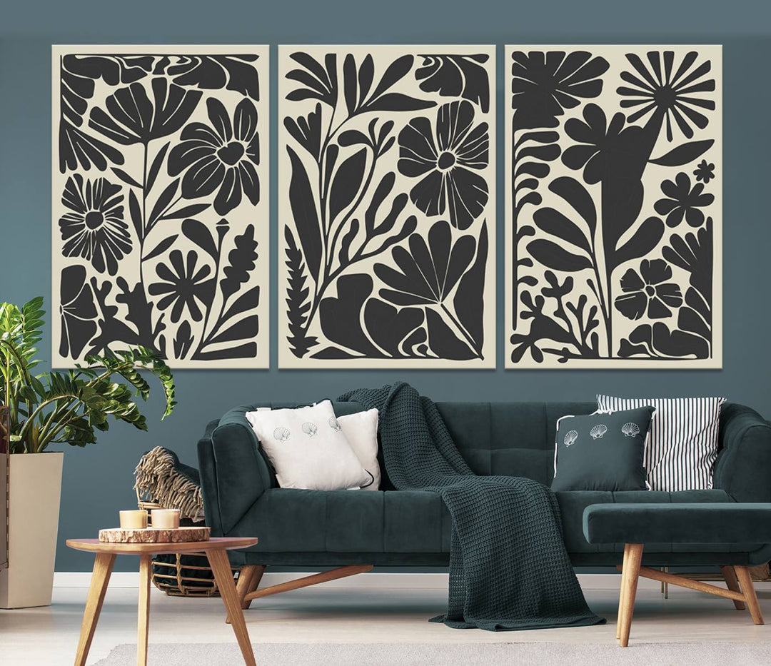 A modern living room features framed black & white botanical wall art that adds flair.