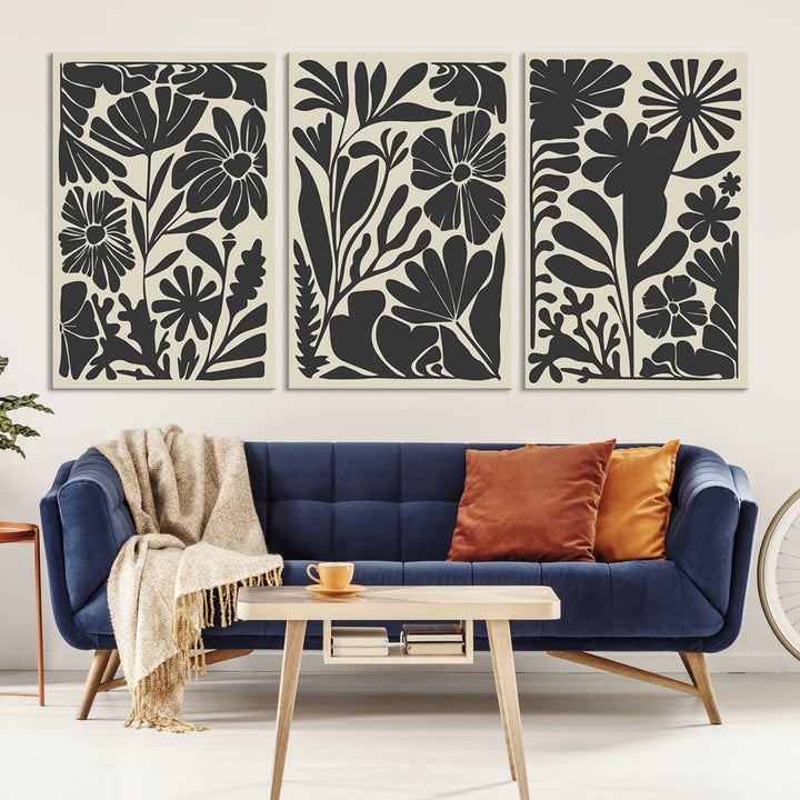 A modern living room features framed black & white botanical wall art that adds flair.