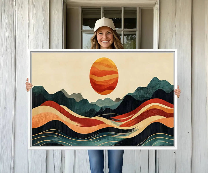 Enhance your contemporary kitchen with the "Mountain Triptych Wall Art - Western Nature Prints." This framed boho canvas depicts an abstract landscape featuring an orange sun rising over stylized mountains and wavy lines, all crafted with a gallery-quality finish for a striking visual impact.