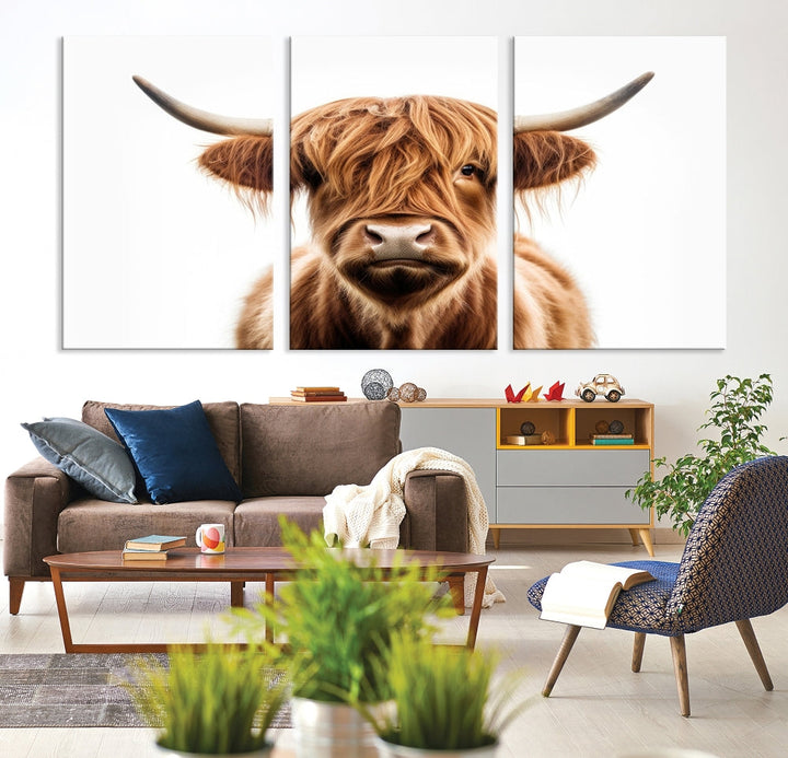 A Scottish Highland Cow Canvas Print, featuring a trio of panels depicting a long-haired, large-horned Highland cow on museum-quality canvas with UV protection, was displayed.