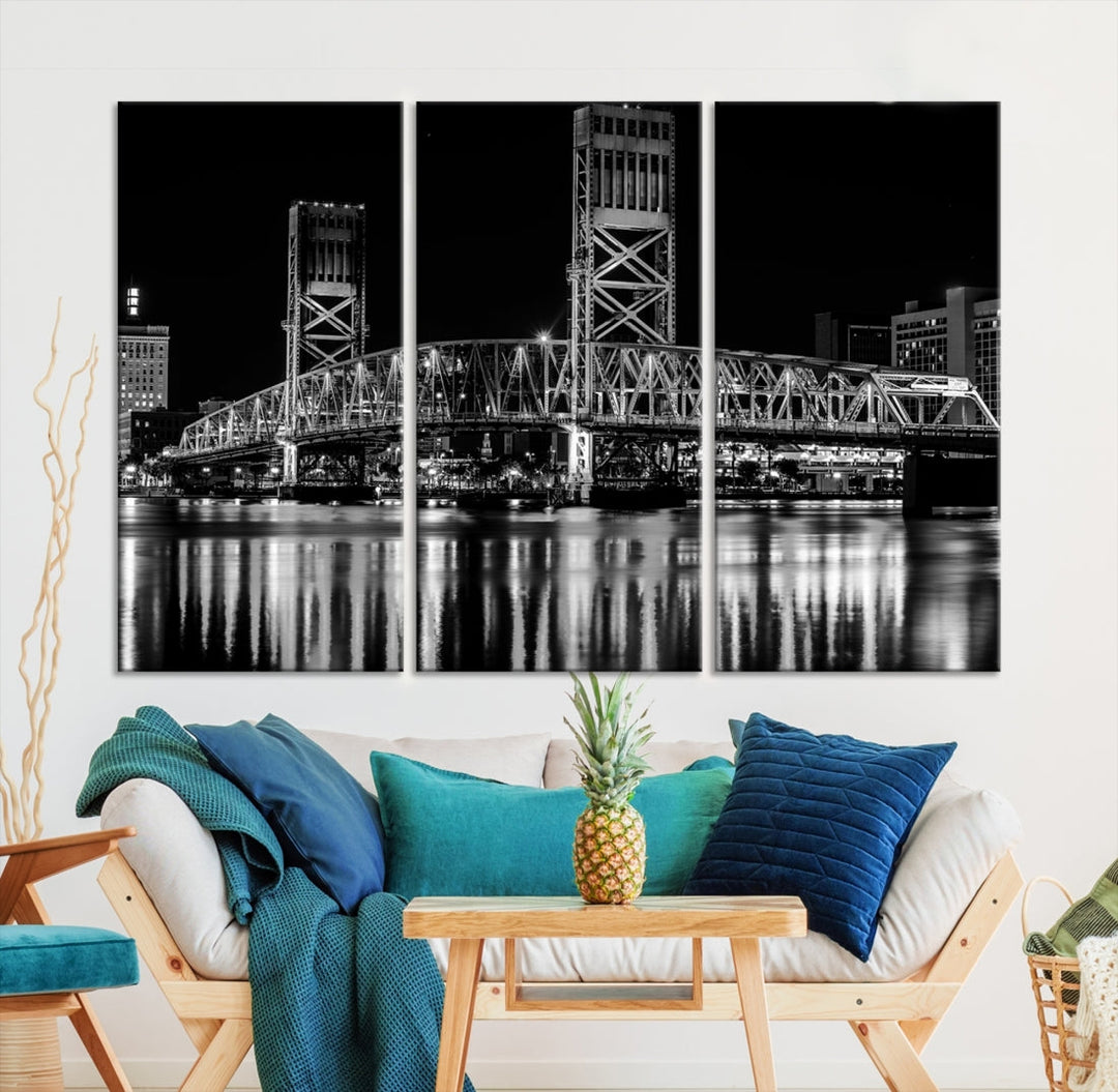 The Jacksonville City Bridge Night Wall Art Canvas Print is a black and white triptych depicting the city bridge at night. It features a UV-protective coating on museum-quality canvas.