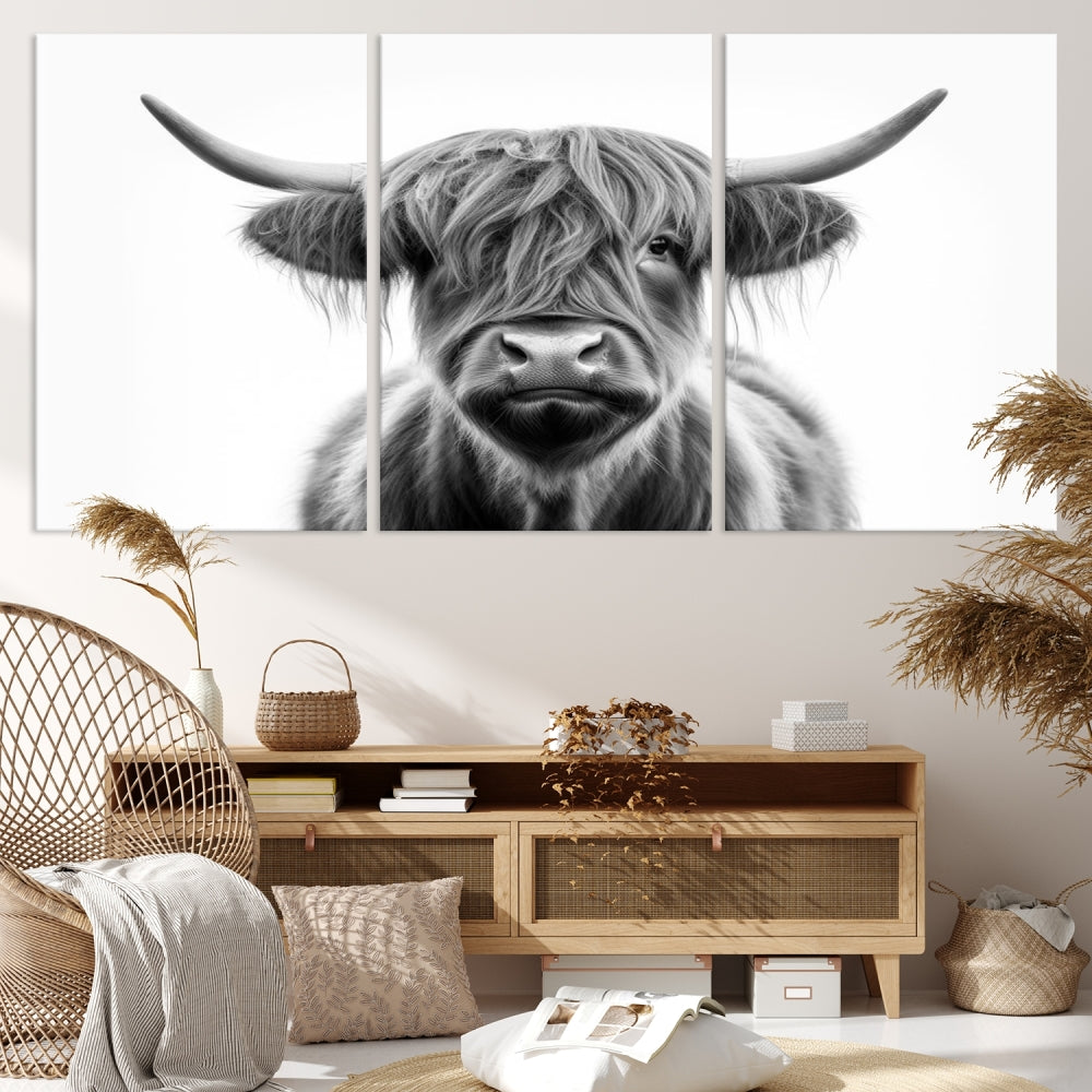 A three-panel wall art from the Highland Cow Animal Canvas series showcases a long-haired, large-horned cow. This Texas Cattle Art Print is crafted on museum-quality canvas with a UV-protective coating, making it an ideal addition to transform your living room.