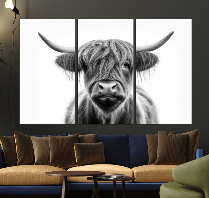 A three-panel wall art from the Highland Cow Animal Canvas series showcases a long-haired, large-horned cow. This Texas Cattle Art Print is crafted on museum-quality canvas with a UV-protective coating, making it an ideal addition to transform your living room.