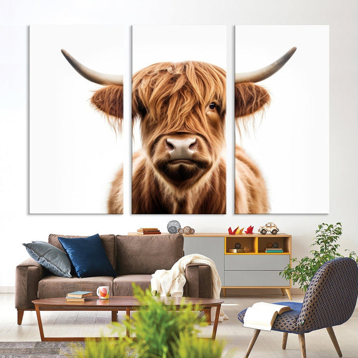 A Scottish Highland Cow Canvas Print, featuring a trio of panels depicting a long-haired, large-horned Highland cow on museum-quality canvas with UV protection, was displayed.