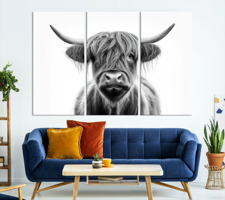 A three-panel wall art from the Highland Cow Animal Canvas series showcases a long-haired, large-horned cow. This Texas Cattle Art Print is crafted on museum-quality canvas with a UV-protective coating, making it an ideal addition to transform your living room.