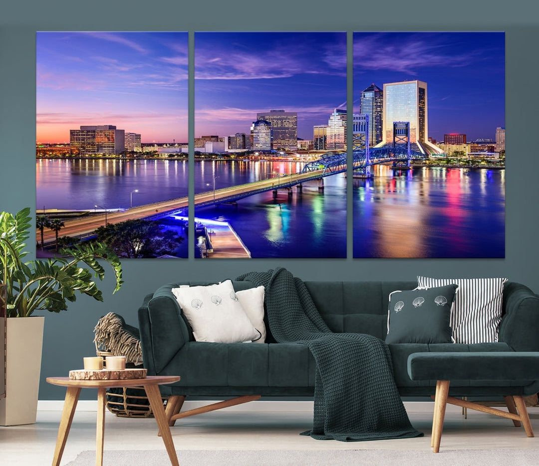 A triptych of the Jacksonville Wall Art Canvas Print, showcasing a cityscape at dusk with a river and illuminated buildings, is elegantly displayed. These museum-quality canvases are coated with UV protection to ensure long-lasting vibrancy.