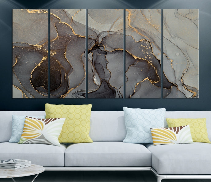 The Gray Marble Fluid Effect Wall Art Abstract Canvas Wall Art Print is a museum-quality canvas featuring triptych abstract art with swirling gray and gold patterns. Complete with a UV-protective coating, this piece of artwork arrives ready to hang, effortlessly elevating your living space.