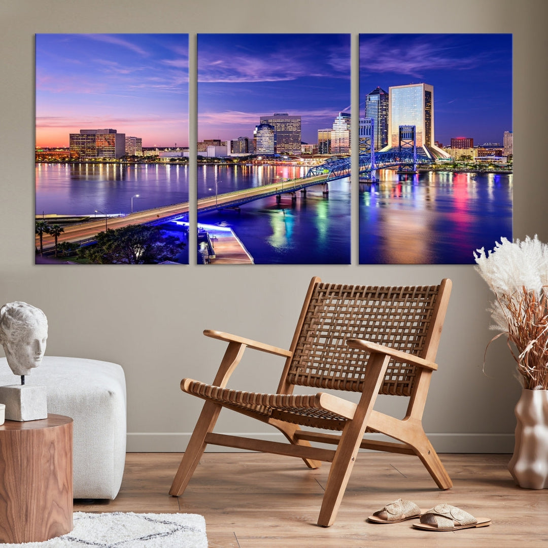 A triptych of the Jacksonville Wall Art Canvas Print, showcasing a cityscape at dusk with a river and illuminated buildings, is elegantly displayed. These museum-quality canvases are coated with UV protection to ensure long-lasting vibrancy.