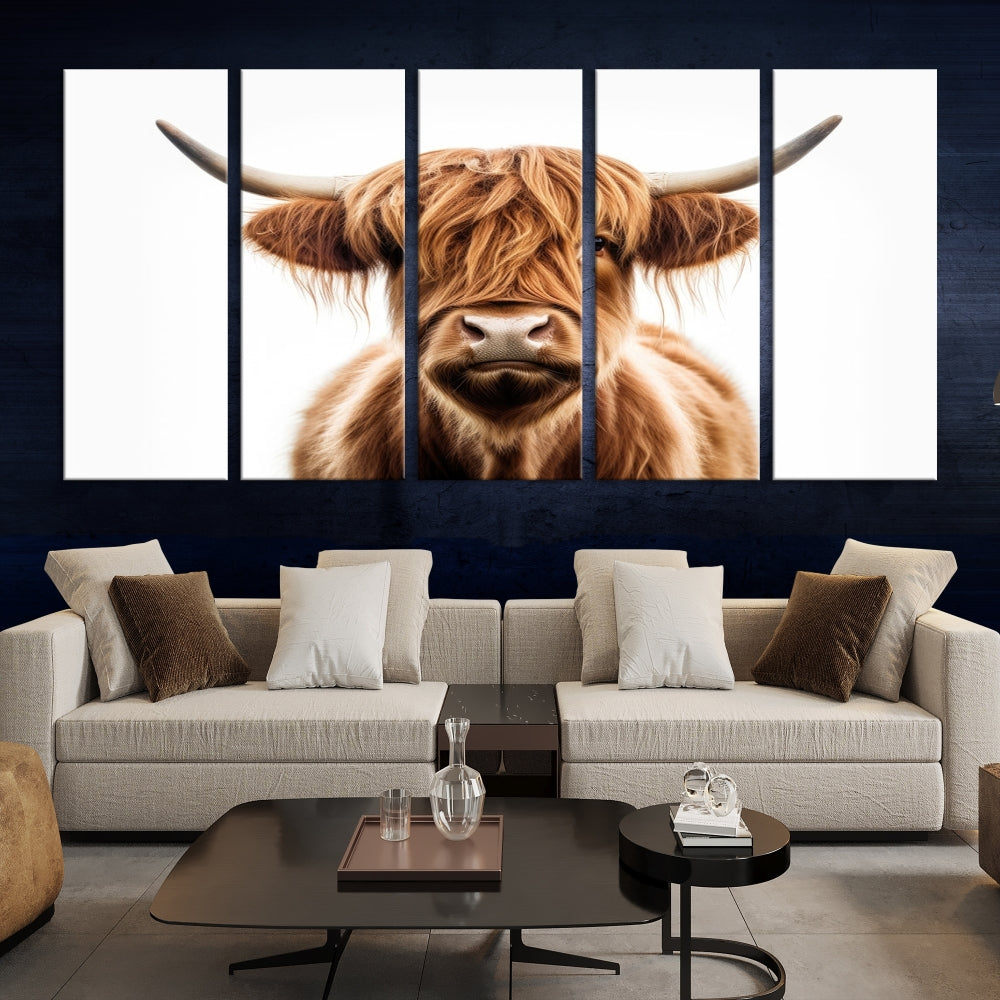 A Scottish Highland Cow Canvas Print, featuring a trio of panels depicting a long-haired, large-horned Highland cow on museum-quality canvas with UV protection, was displayed.