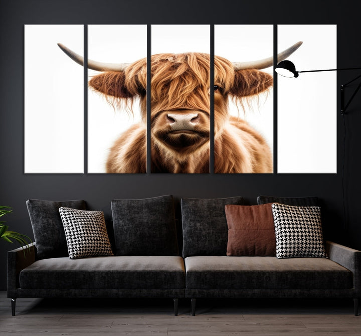 A Scottish Highland Cow Canvas Print, featuring a trio of panels depicting a long-haired, large-horned Highland cow on museum-quality canvas with UV protection, was displayed.