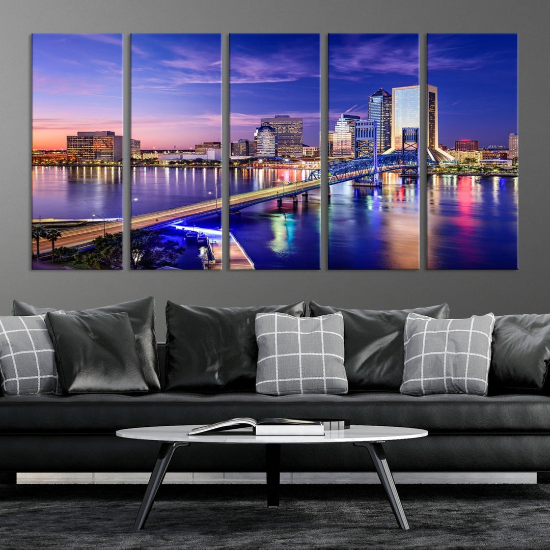 A triptych of the Jacksonville Wall Art Canvas Print, showcasing a cityscape at dusk with a river and illuminated buildings, is elegantly displayed. These museum-quality canvases are coated with UV protection to ensure long-lasting vibrancy.