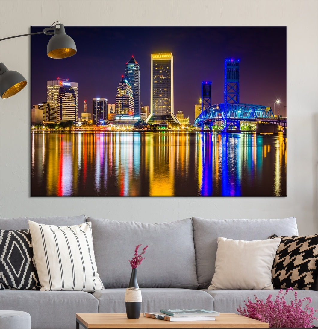 The Jacksonville City cityscape wall art captures a vibrant city skyline at night with colorful reflections in the water and is elegantly displayed on museum-quality gallery wrapped canvas.