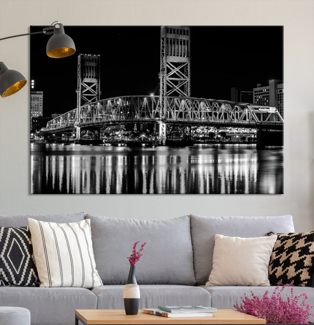 The Jacksonville City Bridge Night Wall Art Canvas Print is a black and white triptych depicting the city bridge at night. It features a UV-protective coating on museum-quality canvas.