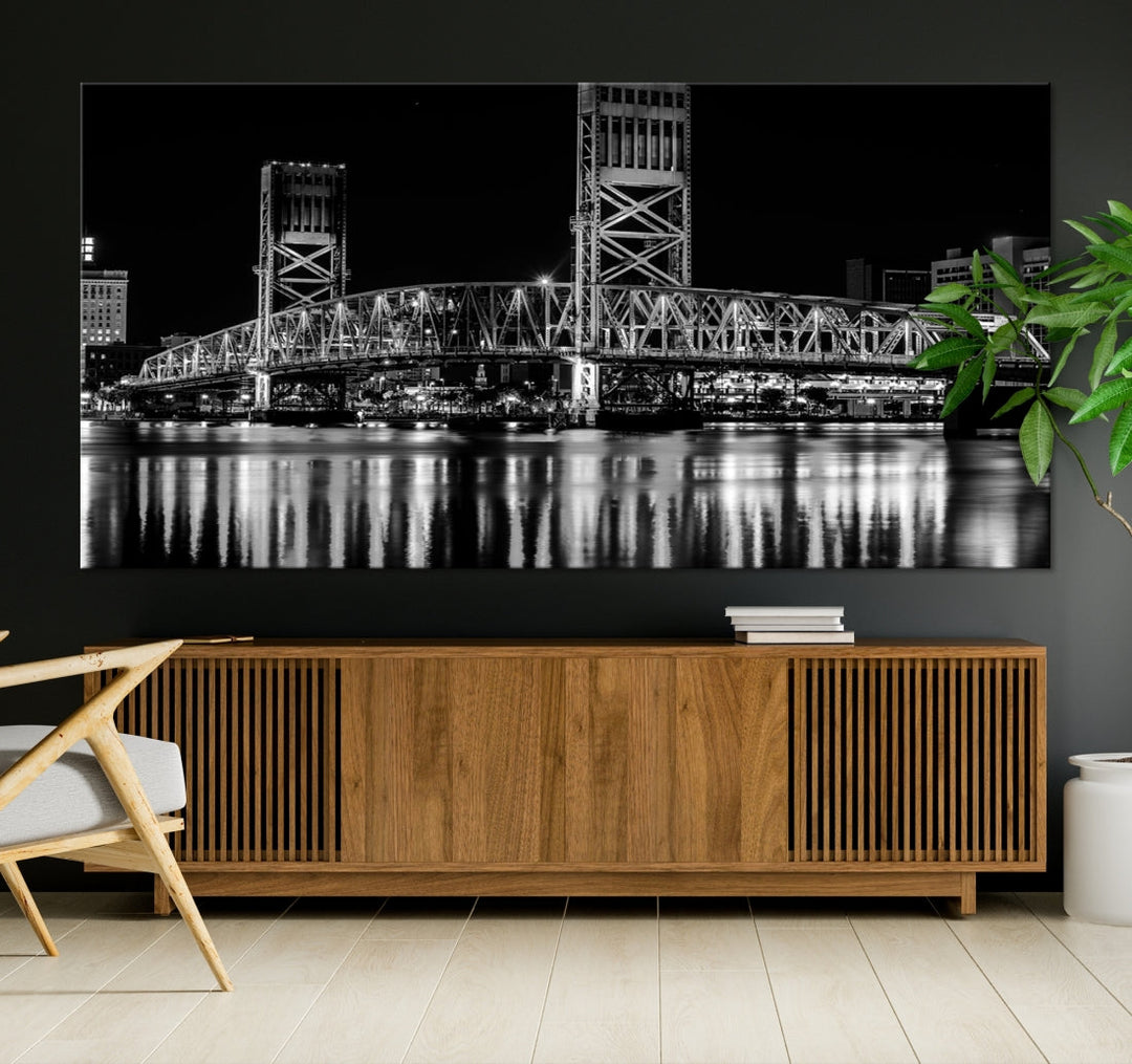 The Jacksonville City Bridge Night Wall Art Canvas Print is a black and white triptych depicting the city bridge at night. It features a UV-protective coating on museum-quality canvas.