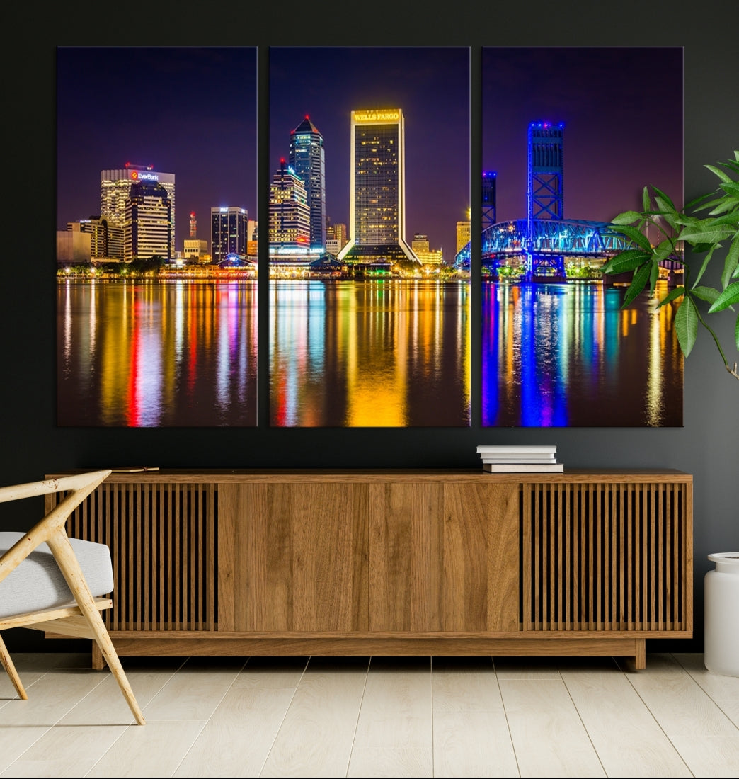 The Jacksonville City cityscape wall art captures a vibrant city skyline at night with colorful reflections in the water and is elegantly displayed on museum-quality gallery wrapped canvas.