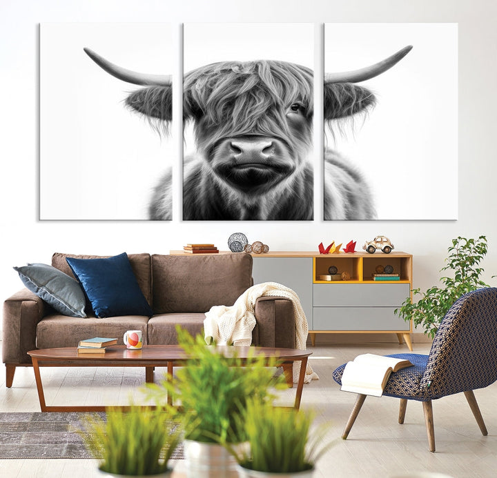 A three-panel wall art from the Highland Cow Animal Canvas series showcases a long-haired, large-horned cow. This Texas Cattle Art Print is crafted on museum-quality canvas with a UV-protective coating, making it an ideal addition to transform your living room.