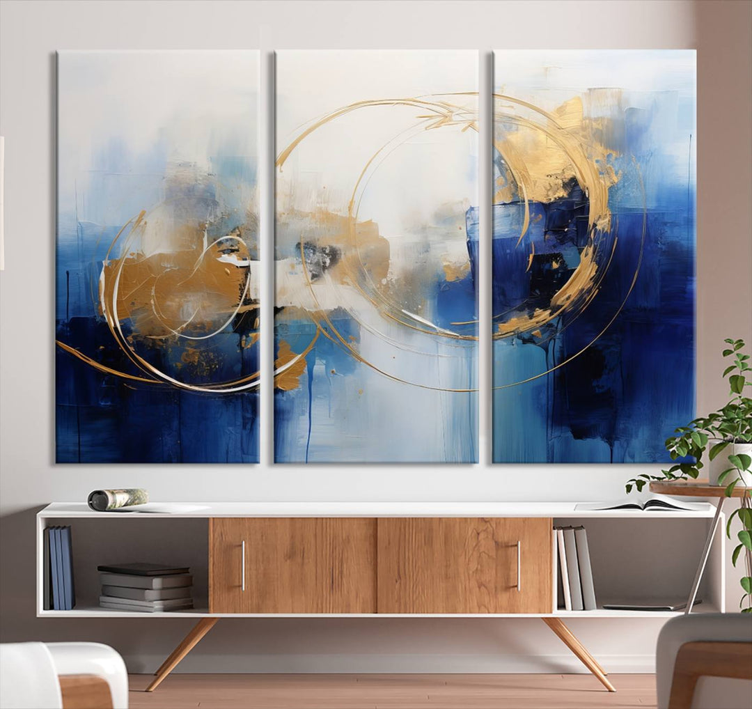 The Navy Blue Abstract Wall Art Canvas Print, featuring a UV-protective coating and a ready-to-hang design, enhances the living room wall. Crafted on museum-quality canvas, its vibrant hues ensure enduring brilliance.