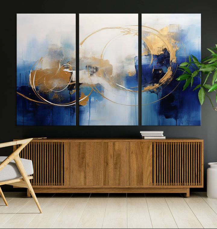 The Navy Blue Abstract Wall Art Canvas Print, featuring a UV-protective coating and a ready-to-hang design, enhances the living room wall. Crafted on museum-quality canvas, its vibrant hues ensure enduring brilliance.