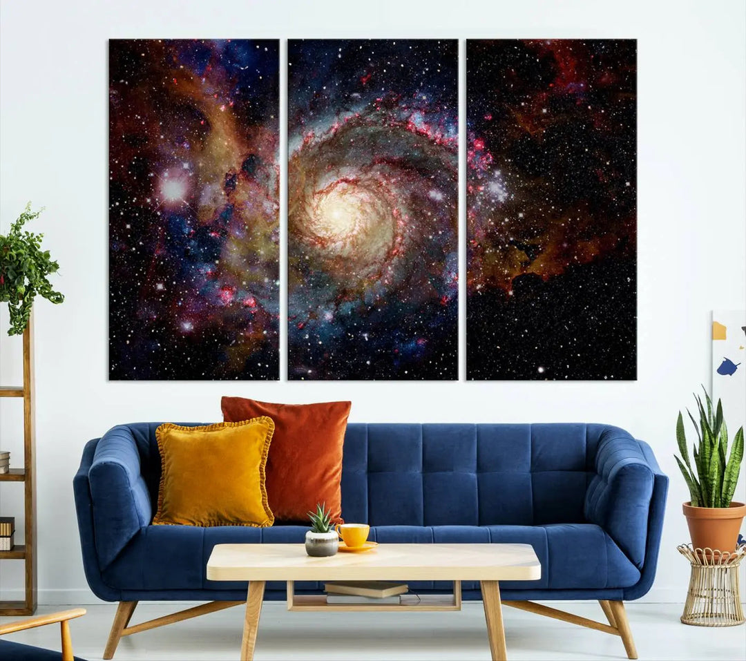 The modern living room is adorned with the Nebula and Galaxies in Space Wall Art, a spiral galaxy canvas print that showcases high-resolution details on museum-quality canvas. The UV-protective coating ensures its stunning allure is preserved.