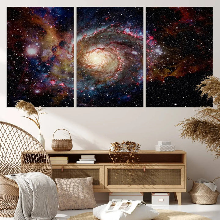 The modern living room is adorned with the Nebula and Galaxies in Space Wall Art, a spiral galaxy canvas print that showcases high-resolution details on museum-quality canvas. The UV-protective coating ensures its stunning allure is preserved.