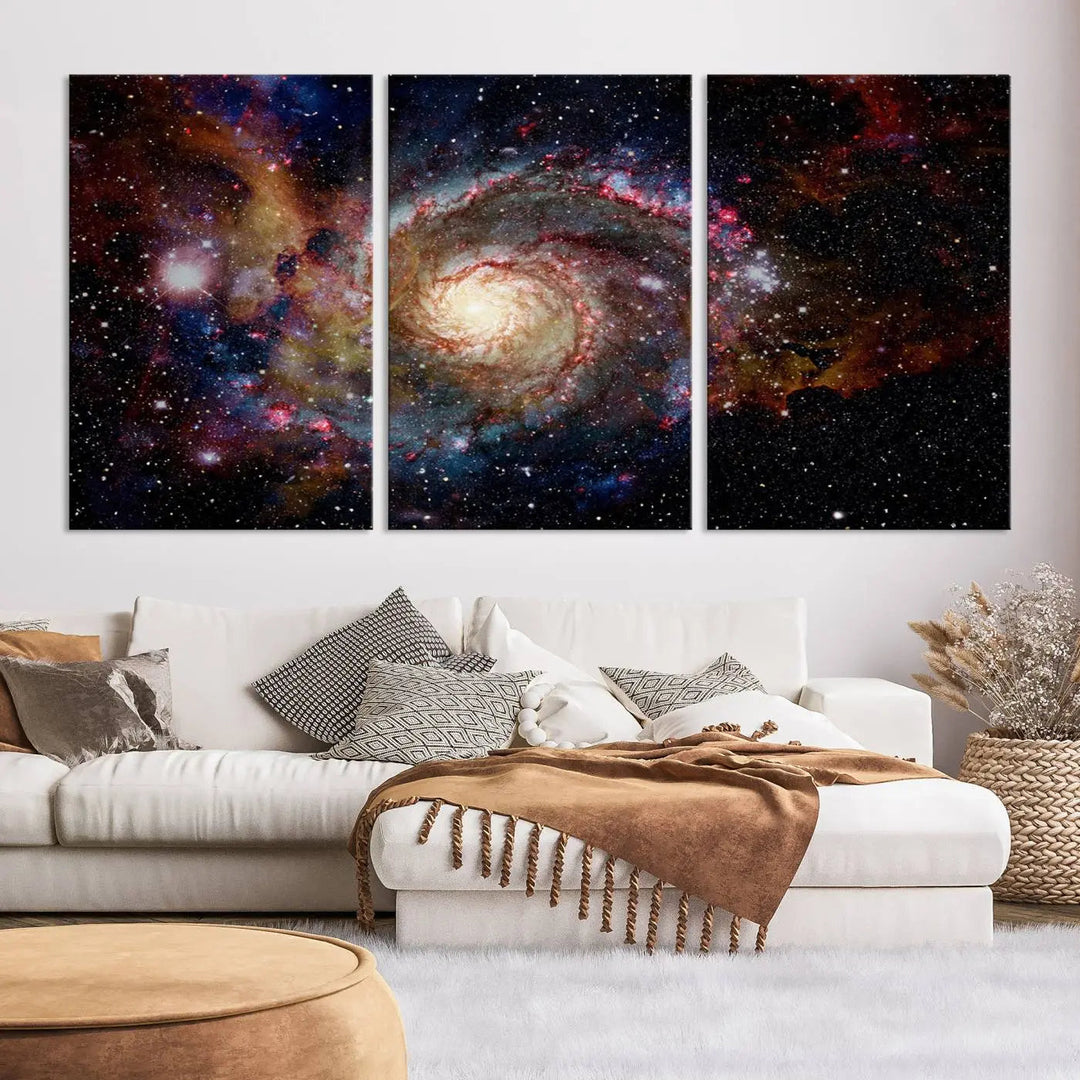 The modern living room is adorned with the Nebula and Galaxies in Space Wall Art, a spiral galaxy canvas print that showcases high-resolution details on museum-quality canvas. The UV-protective coating ensures its stunning allure is preserved.