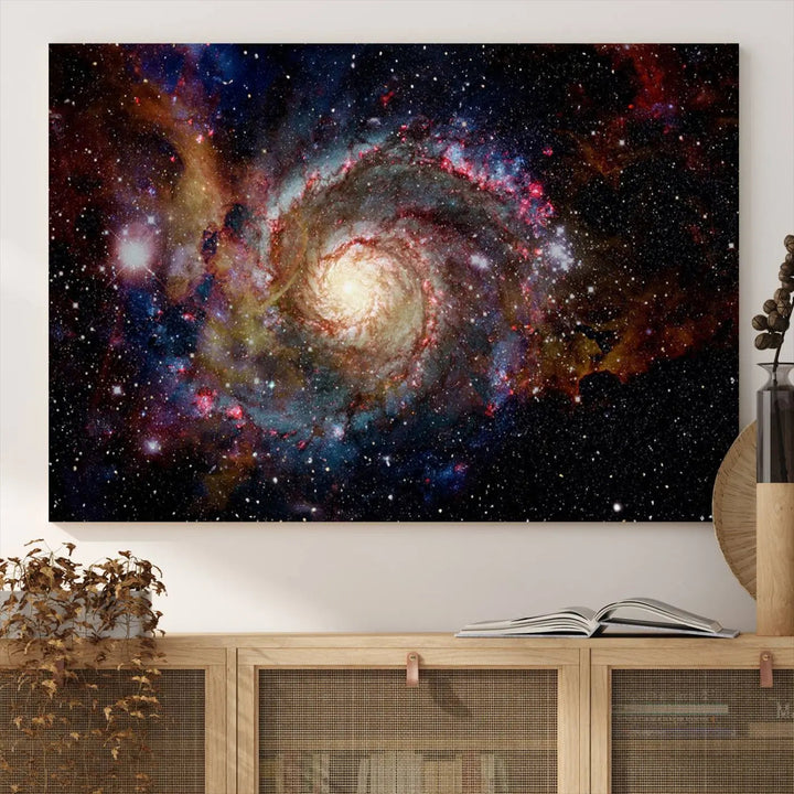 The modern living room is adorned with the Nebula and Galaxies in Space Wall Art, a spiral galaxy canvas print that showcases high-resolution details on museum-quality canvas. The UV-protective coating ensures its stunning allure is preserved.