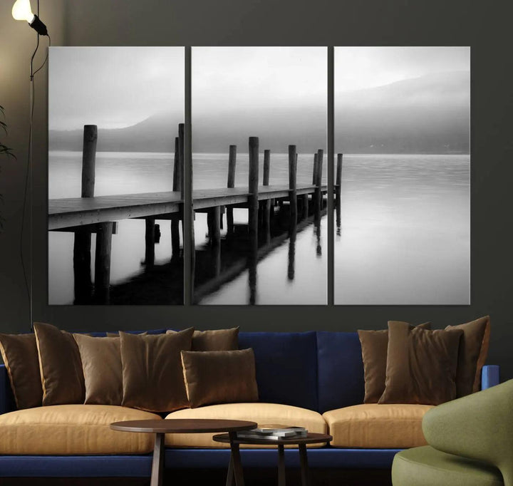 The "Ocean Beach Canvas Wall Art" is a black-and-white triptych depicting a serene dock over water.