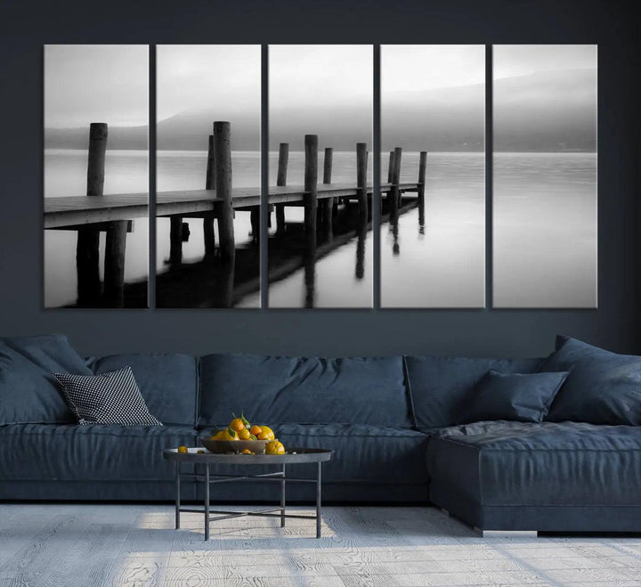 The "Ocean Beach Canvas Wall Art" is a black-and-white triptych depicting a serene dock over water.